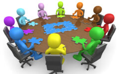 Group Of Colorful And Diverse People Holding A Meeting And Trying To Solve A Jigsaw Around A Large Rectangular Conference Table In An Office Clipart Illustration Image